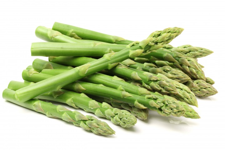 fresh green asparagus on white