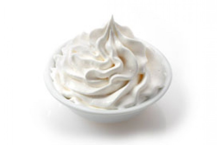 white color bowl filled with fresh cream 