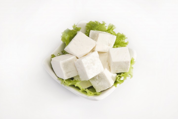 piece of cheese or paneer isolated on a white background