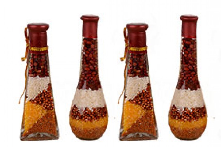 attractive glass bottles filled with different pulses and bean 