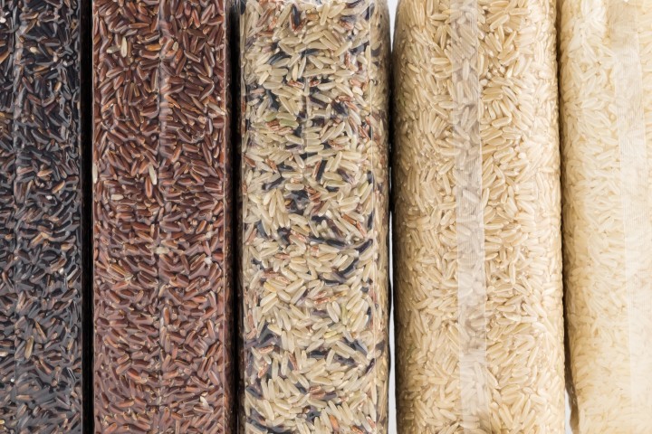 jasmine rice brown rice red rice mixed rice and riceberry rice in a plastic vacuum bag