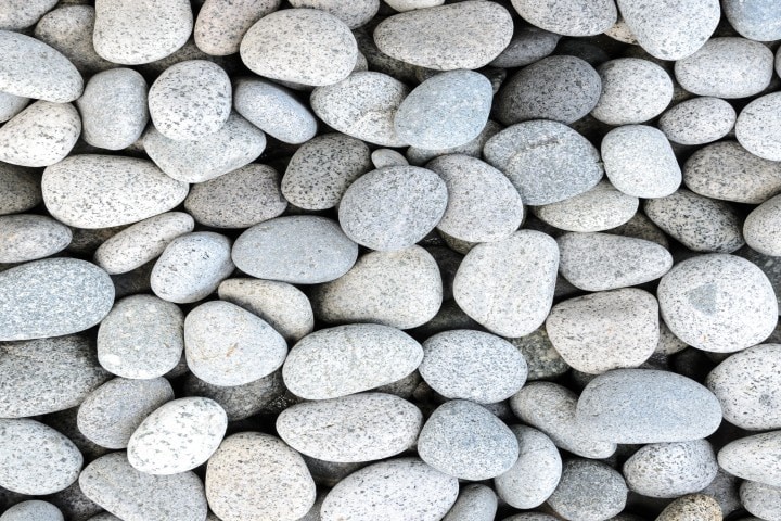 naturally polished white rock pebbles background